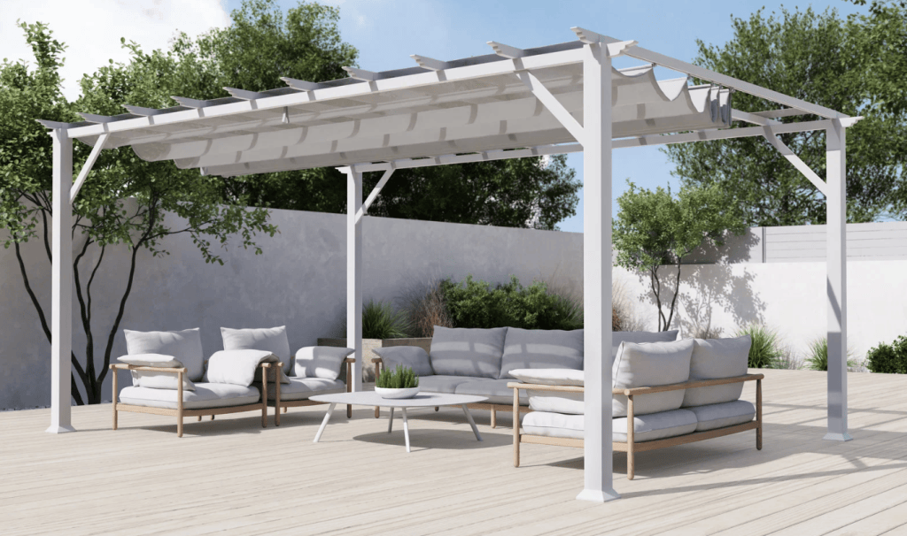 White Paragon Florence pergola with a retractable gray fabric canopy over an outdoor seating area.
